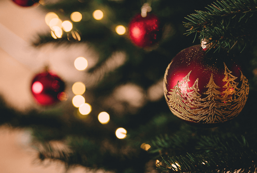 Red Christmas ornament on a tree