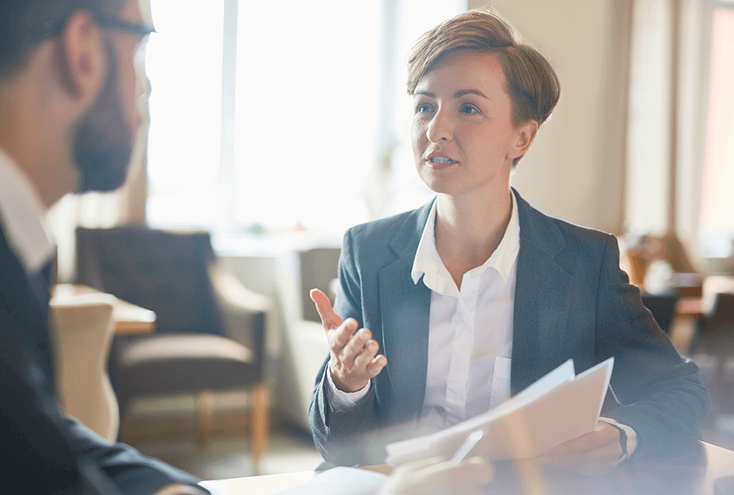 Two employees talking in an office