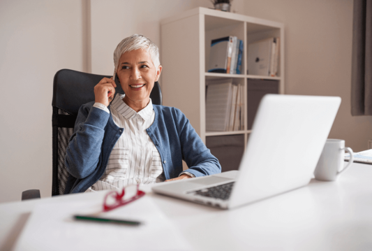 Woman on the phone at her desk